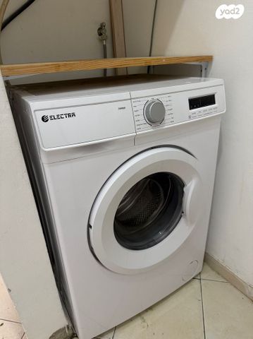 ‏מכונת כביסה