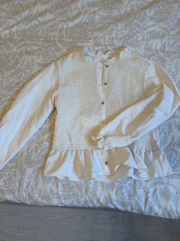 מכופתרת ZARA
