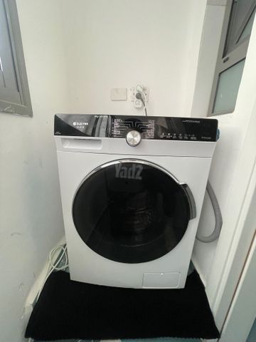 ‏מכונת כביסה