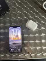 iPhone 15 pro with AirPods