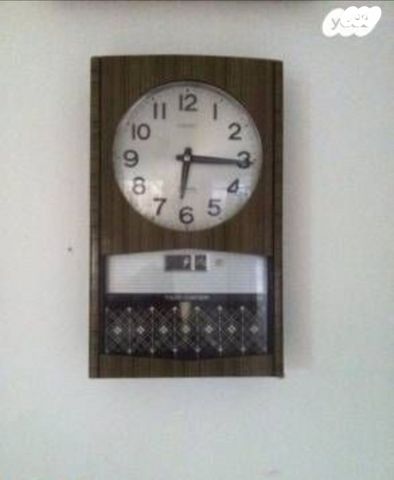שעון קיר seiko בערבית