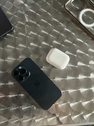 iPhone 15 pro with AirPods