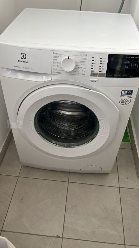 ‏מכונת כביסה