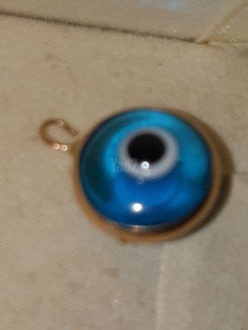 תליין זהב עם עין כחולה