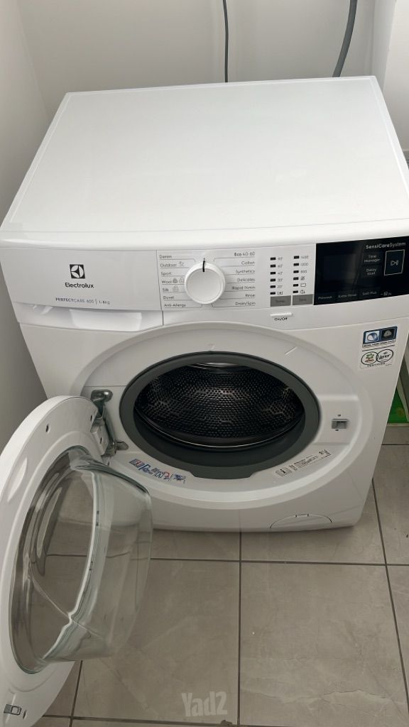 ‏מכונת כביסה
