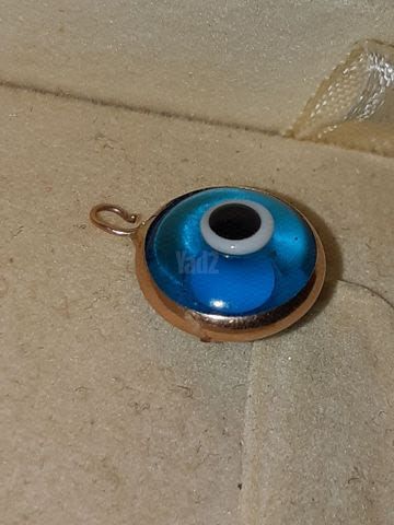 תליין זהב עם עין כחולה